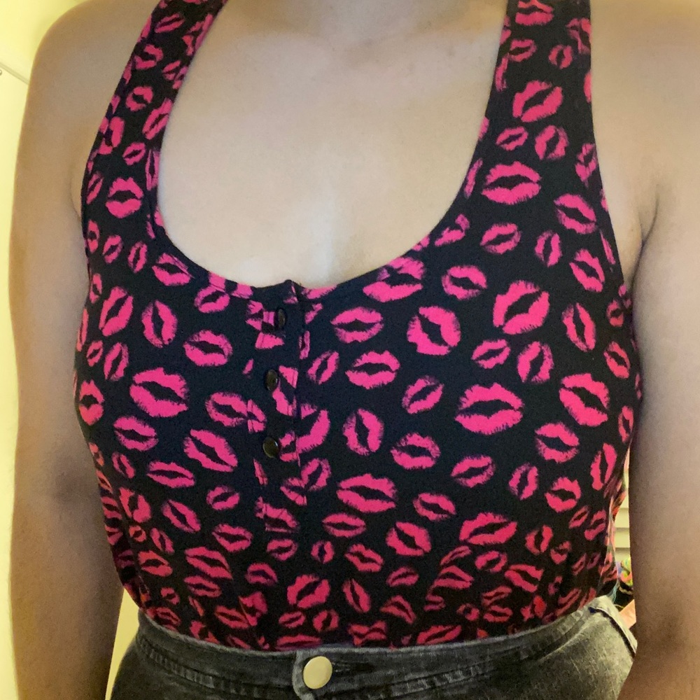 Black flowy top with lip pattern